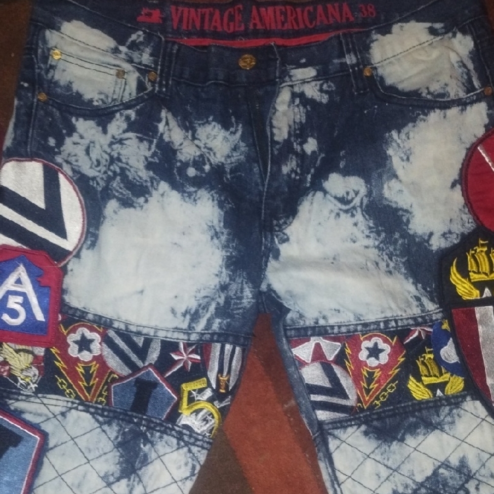 Vintage America blue acid-wash denim shorts with red and yellow patches